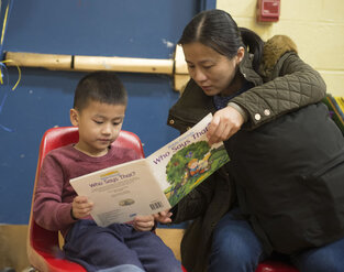 ESOL Parent Reading to Her Child at Family Literacy Night